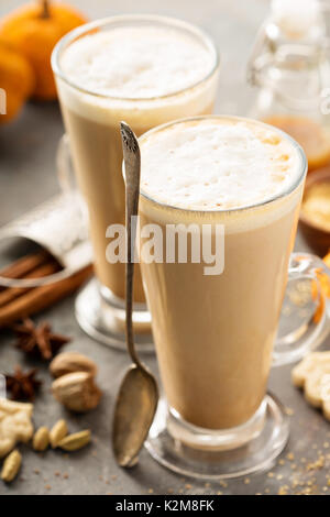 Pumpkin spice latte in tall mugs with cinnamon, nutmeg and cardamom Stock Photo