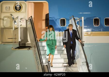 U.S. President Donald Trump and First Lady Melania Trump deplane from Air Force One for a visit to Warsaw July 5, 2017 in Warsaw, Poland. Stock Photo