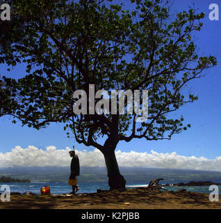 Big Island, Hawaii, USA. 17th July, 2010. A snorkeler maker her way along the rocks to the ocean at Keaukaha Beach Park in Hilo on the Big Island, Hawaii. Credit: L.E. Baskow/ZUMA Wire/Alamy Live News Stock Photo