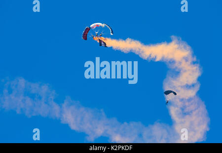 Bournemouth, UK. 31st Aug, 2017. The Tigers Freefall Parachute Team open the tenth anniversary of the Bournemouth Air Festival ahead of the flying later this afternoon. 4 Four parachutists with their parachutes canopies - Army Be The Best against blue sky. Credit: Carolyn Jenkins/Alamy Live News Stock Photo