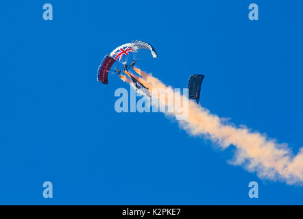 Bournemouth, UK. 31st Aug, 2017. The Tigers Freefall Parachute Team open the tenth anniversary of the Bournemouth Air Festival ahead of the flying later this afternoon. 4 Four parachutists with their parachutes canopies - Army Be The Best against blue sky. Credit: Carolyn Jenkins/Alamy Live News Stock Photo