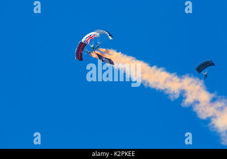 Bournemouth, UK. 31st Aug, 2017. The Tigers Freefall Parachute Team open the tenth anniversary of the Bournemouth Air Festival ahead of the flying later this afternoon. 4 Four parachutists with their parachutes canopies - Army Be The Best against blue sky. Credit: Carolyn Jenkins/Alamy Live News Stock Photo