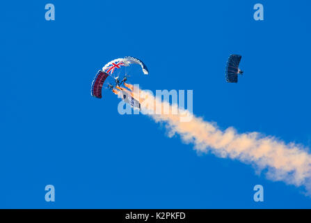 Bournemouth, UK. 31st Aug, 2017. The Tigers Freefall Parachute Team open the tenth anniversary of the Bournemouth Air Festival ahead of the flying later this afternoon. 4 Four parachutists with their parachutes canopies - Army Be The Best against blue sky. Credit: Carolyn Jenkins/Alamy Live News Stock Photo