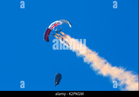 Bournemouth, UK. 31st Aug, 2017. The Tigers Freefall Parachute Team open the tenth anniversary of the Bournemouth Air Festival ahead of the flying later this afternoon. 4 Four parachutists with their parachutes canopies - Army Be The Best against blue sky. Credit: Carolyn Jenkins/Alamy Live News Stock Photo