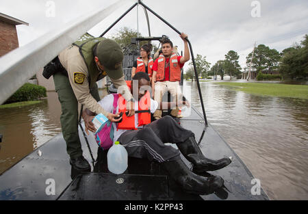 Houston, United States. 30th Aug, 2017. U.S Border Patrol riverine agents on an air boat evacuate residents from a neighborhood flooded by rising waters in the aftermath of Hurricane Harvey August 30, 2017 in Houston, Texas. Credit: Planetpix/Alamy Live News Stock Photo