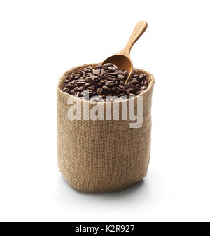 Coffee beans, burlap sack and wooden scoop isolated on white background Stock Photo