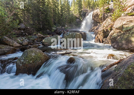 Sunbeams in the mist from Alberta Falls in Glacier Gorge in Rocky Mountain National Park, Colorado Stock Photo