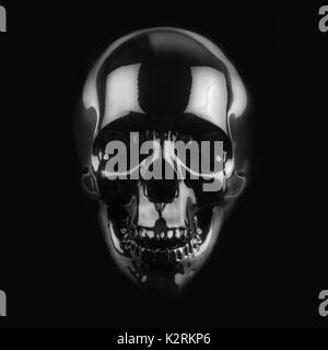 front view of polished shinny wooden skull on dark background Stock Photo