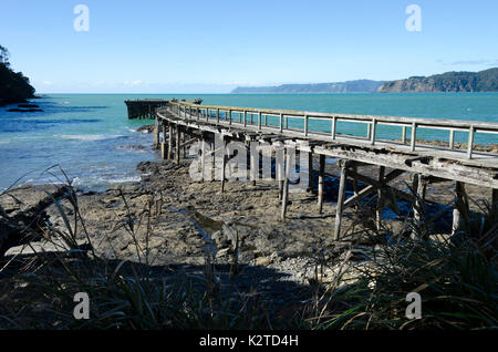 Old wooden wharf, Hicks Bay, Ohiwa, near Opotiki, Bay Of Plenty, North Island, New Zealand Stock Photo