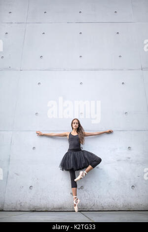 Attractive ballerina posing outdoors Stock Photo