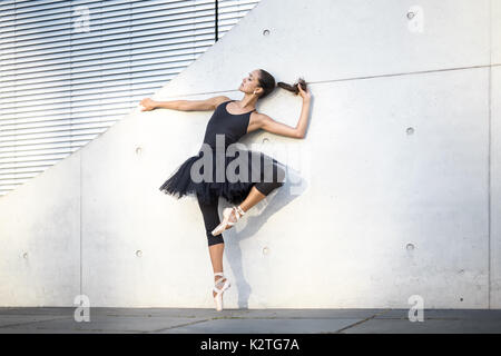 Attractive ballerina posing outdoors Stock Photo