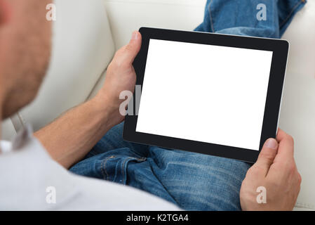 Close-up Of Person Holding Blank Screen Digital Tablet Stock Photo