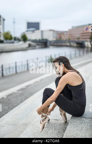 Attractive ballerina posing outdoors Stock Photo