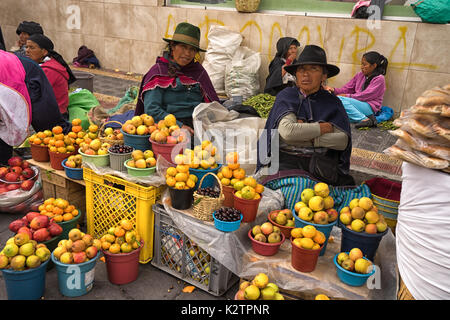 May 6, 2017 Otavalo, Ecuador: indigenous produce vendors in the Saturday market Stock Photo