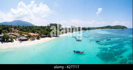 Aerial panoramic view of Pattaya Beach over crystal clear tropical water on island paradise Ko Lipe, Thailand Stock Photo