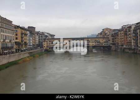 Old Bridge, medieval stone closed-spandrel segmental arch bridge over the Arno River, in Florence Stock Photo