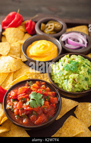 mexican nachos with guacamole, salsa and cheese dip Stock Photo