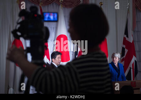 Prime Minister Theresa May and her Japanese counterpart Shinzo Abe during a press conference at Akasaka Palace state guesthouse in Tokyo as part of her visit to Japan. Stock Photo