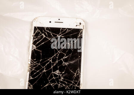 Paris, FRANCE - August 26, 2017: close up of an iphone 6S of the mark Apple Inc. whose screen is broken as a result of a violent fall Stock Photo