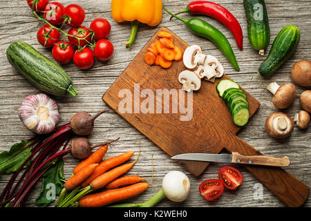 Various fresh vegetables and ingredients on wooden rustic background Stock Photo