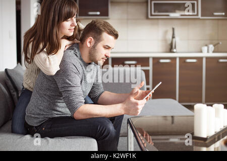 Young couple having fun with surfing the net Stock Photo