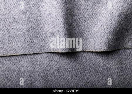 Grey herringbone tweed fabric, herringbone textile background for fashion designers. Stock Photo