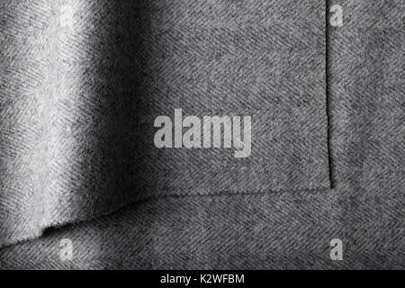 Grey herringbone tweed fabric, herringbone textile background for fashion designers. Stock Photo