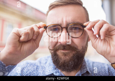 Bearded fashion man wearing stylish glasses Stock Photo