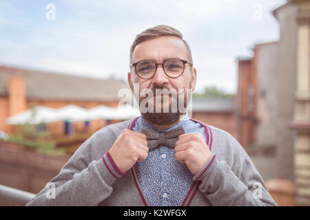 Elegant man wearing bow tie and stylish glasses Stock Photo