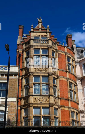 British traditional beautiful brick house with chimney and glass window ...