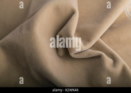 Velour beige fabric textile background. with velvet effect. Stock Photo