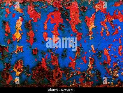 Abstract of blue, red and yellow paint on metal Stock Photo