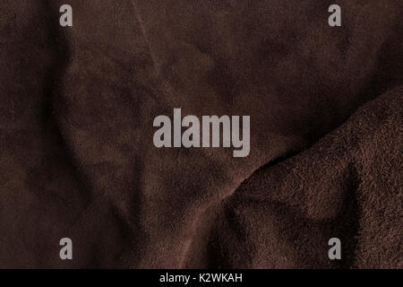 Rough Italian brown chamois leather texture background. Stock Photo