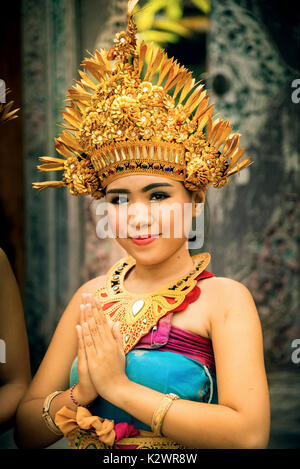 Bali; Indonesia - July 06; 2017. Portrait of a traditional dressed Balinese welcome girl at a dance show in Bali Indonesia. Stock Photo