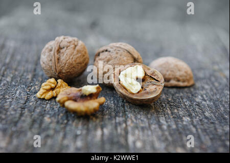 Walnuts at old wooden plank Stock Photo