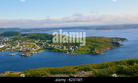 Panorama of St Anthony and the Atlantic ocean with icebergs in distance, Great Northern peninsula, Newfoundland, Canada Stock Photo