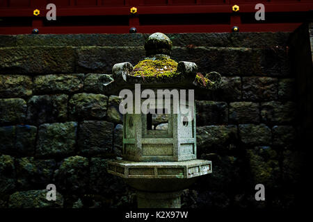 Mossy stone lantern with close-up detailed view Stock Photo