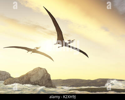 Two pteranodons flying over rocks in the sea Stock Photo