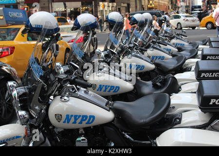 NYPD motorbike users take a break on the streets of NYC. New York City NYPD motorbike close up in Times Square Harley Davidson police bike parked up