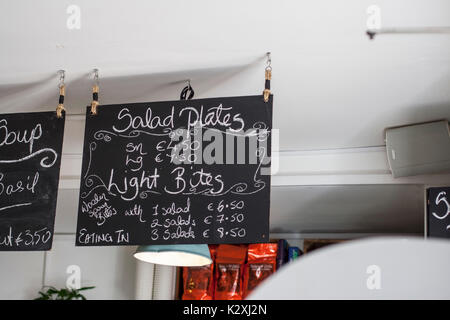 Cafe menu chalkboard hanging from ceiling the special, black white ...