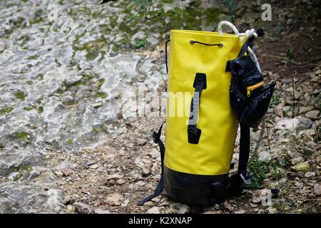 Climbing rope inside a yellow backpack. Stock Photo