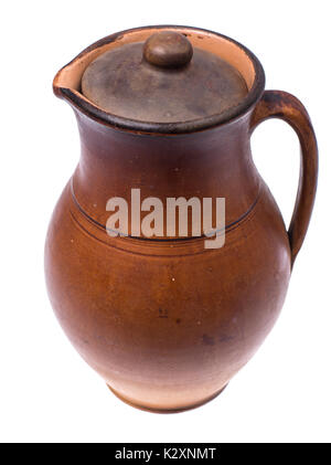 Clay pitcher with lid for water and milk, isolated on white background. Studio Photo Stock Photo