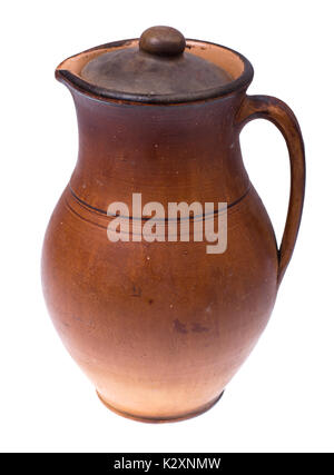 Clay pitcher with lid for water and milk, isolated on white background. Studio Photo Stock Photo