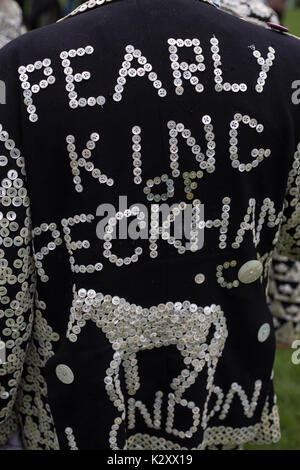 Pearly King, Queen and Prince of Peckham, in their Pearly Kings clothes, outside Houses of Parliament and Big Ben, London, England, UK. Stock Photo