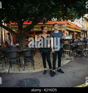 A waiter and waitress pose for a picture in Juan les Pins, Cote d'Azur, France Stock Photo