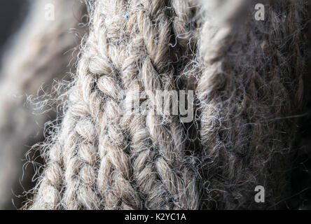 highly detailed needlework wool fabric, close up wool texture background. Stock Photo