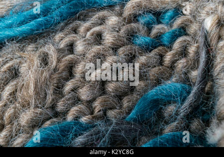 highly detailed needlework wool fabric, close up wool texture background. Stock Photo
