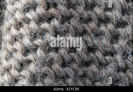 highly detailed needlework wool fabric, close up wool texture background. Stock Photo