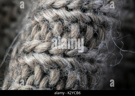highly detailed needlework wool fabric, close up wool texture background. Stock Photo