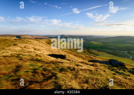 Late evening sunlight from the top of Shining Tor between Buxton and Macclesfield in the Peak District in Cheshire, with the peak of Shutlingsloe in t Stock Photo